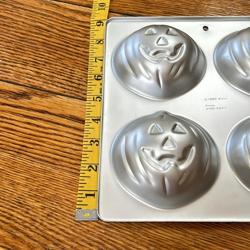 Wilton 4 in 1 Jack-O-Lantern Halloween theme molds/cake pans.  Dated 1990.